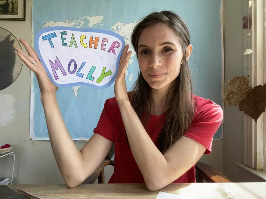 Online Teacher Molly with Sign